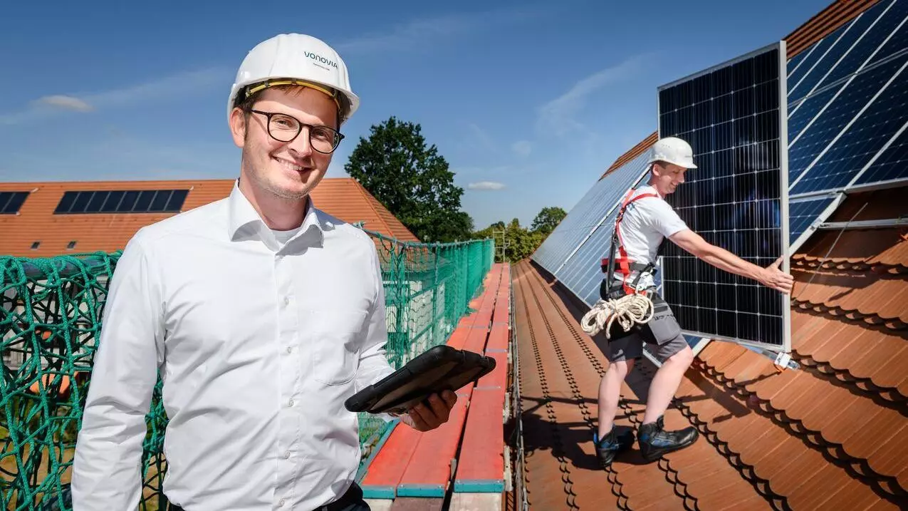 Man installs solar modules on the roof